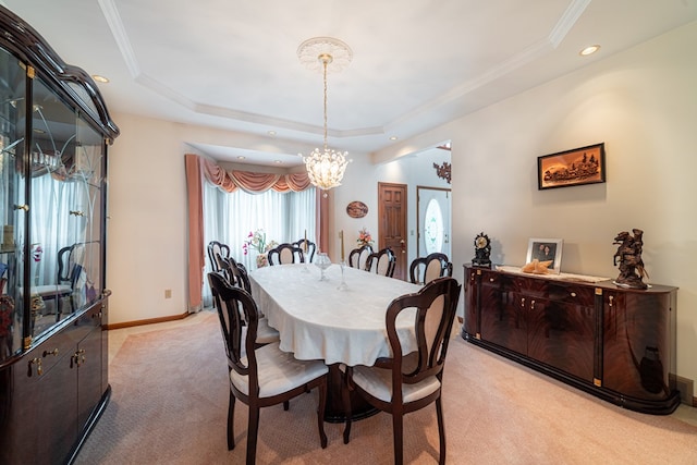 carpeted dining room with a raised ceiling and a notable chandelier