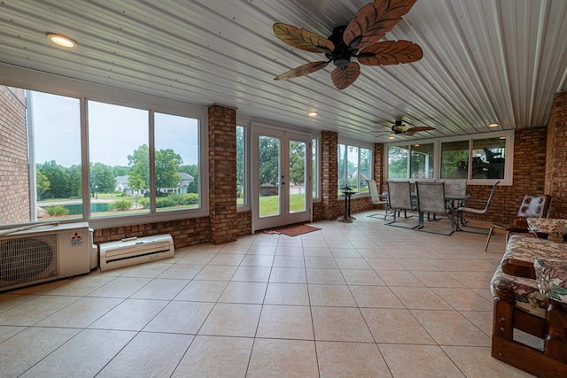 unfurnished sunroom with ceiling fan, wood ceiling, and french doors