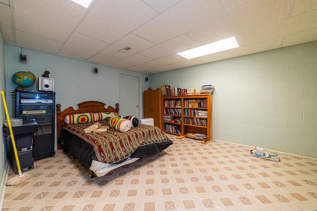 bedroom featuring a drop ceiling