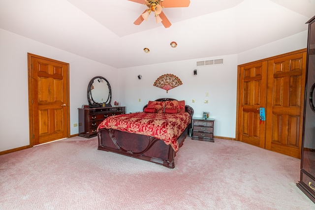 bedroom with ceiling fan, a closet, and light colored carpet