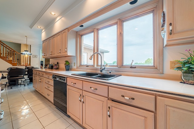 kitchen featuring black dishwasher, decorative light fixtures, plenty of natural light, and sink