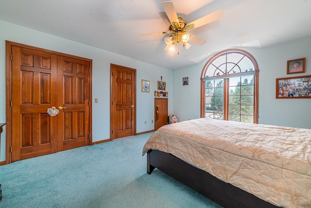 carpeted bedroom with ceiling fan