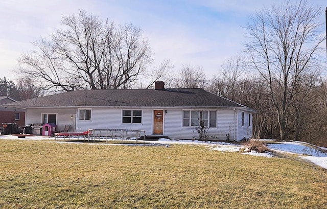 view of front of house featuring a front lawn and a patio