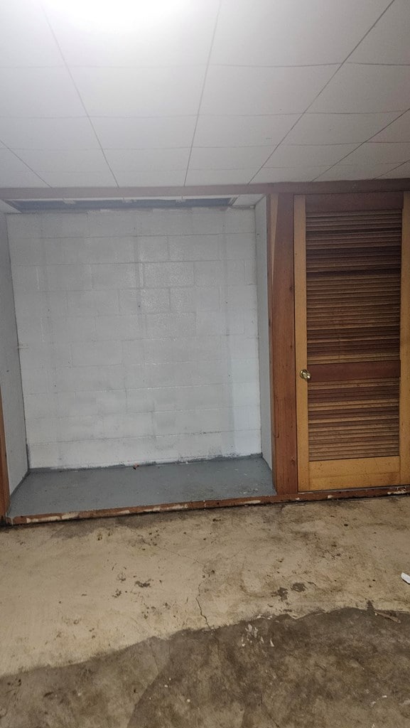 basement featuring a paneled ceiling