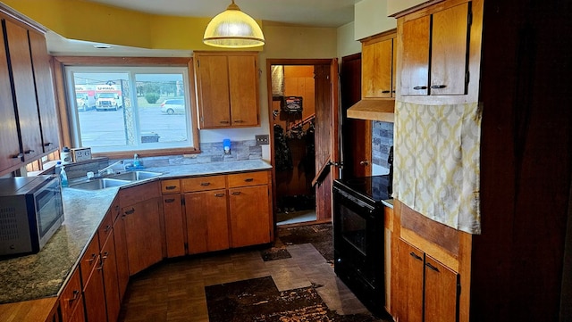 kitchen with sink, hanging light fixtures, electric range, dark parquet flooring, and light stone countertops