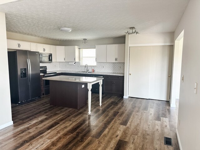 105 Purple Finch Loop, Pataskala, OH 43062 - kitchen with white cabinetry, a sink, appliances with stainless steel finishes, and dark wood finished floors