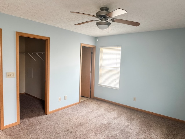 105 Purple Finch Loop, Pataskala, OH 43062 - unfurnished bedroom featuring light colored carpet, baseboards, and a walk in closet