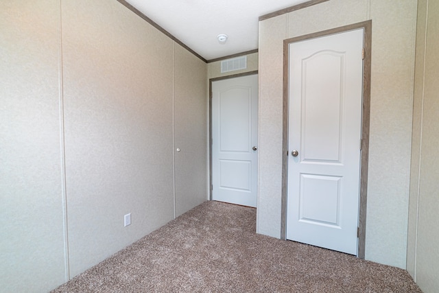 unfurnished bedroom with carpet flooring