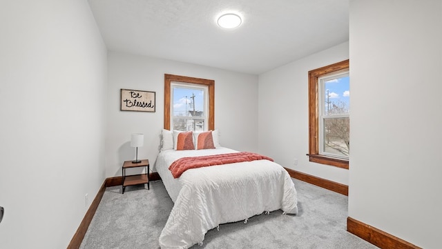 carpeted bedroom with a textured ceiling