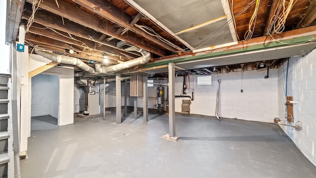 basement with water heater and heating unit