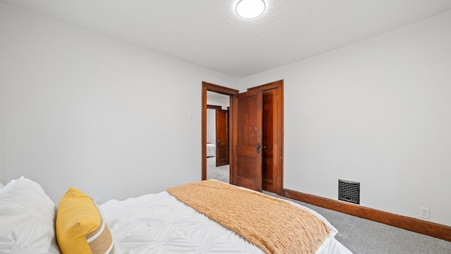 carpeted bedroom with a textured ceiling