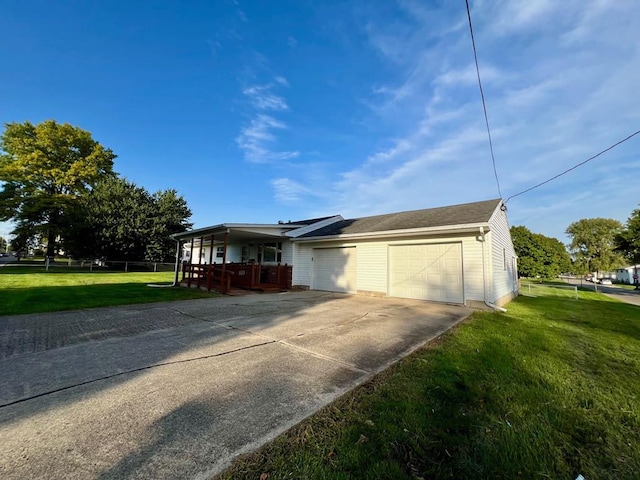 view of front of house featuring a garage and a front lawn