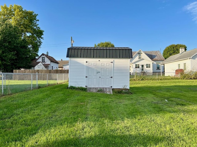 view of outbuilding with a yard