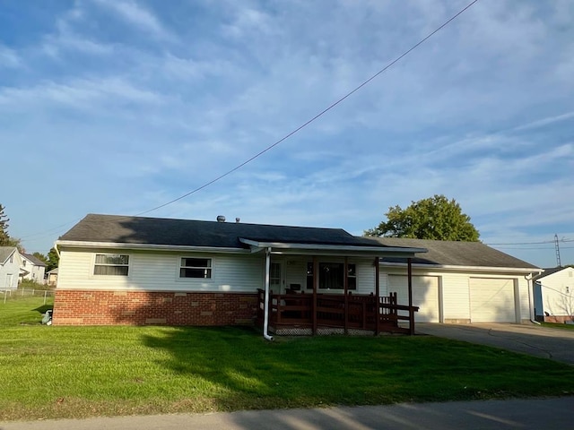 ranch-style home with a porch, a garage, and a front yard