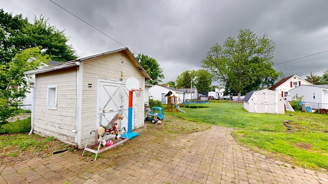 12 W Park Dr, Shelby, OH 44875 - view of yard featuring a trampoline, a patio, and a residential view