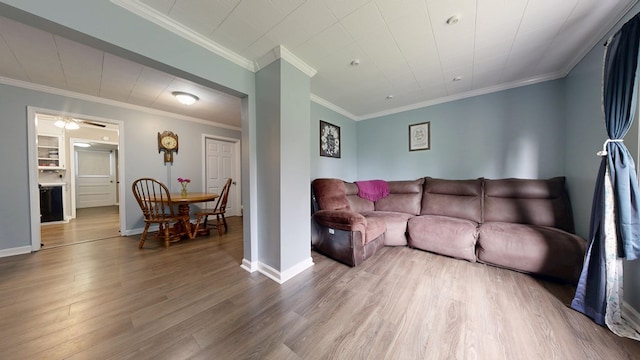 12 W Park Dr, Shelby, OH 44875 - living area featuring wood finished floors, baseboards, and ornamental molding