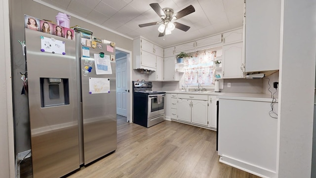 12 W Park Dr, Shelby, OH 44875 - kitchen with stainless steel appliances, white cabinetry, ceiling fan, and crown molding