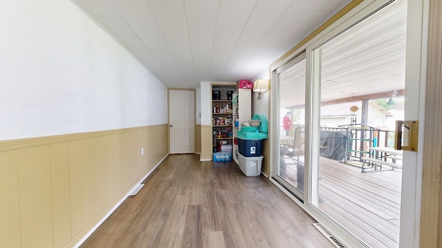 12 W Park Dr, Shelby, OH 44875 - corridor featuring wood finished floors and wainscoting