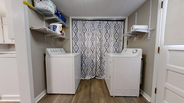 12 W Park Dr, Shelby, OH 44875 - laundry room with separate washer and dryer, wood finished floors, and baseboards