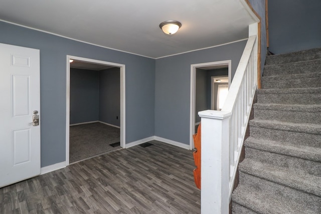 stairway featuring hardwood / wood-style floors