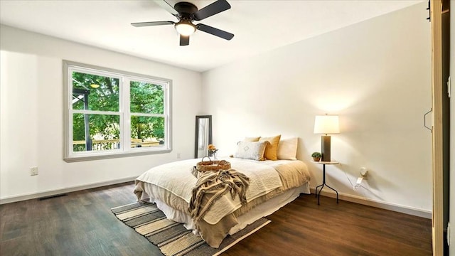 3306 Township Rd Unit 221, Marengo, OH 43334 - bedroom with dark wood-style floors and ceiling fan