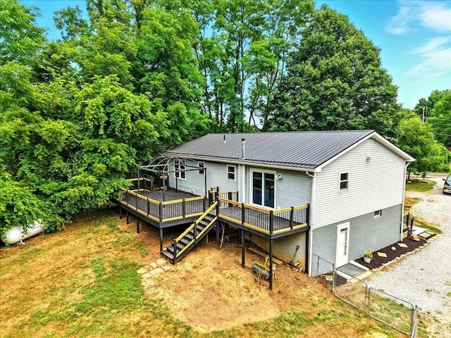 3306 Township Rd Unit 221, Marengo, OH 43334 - rear view of property with a deck, a metal roof, stairs, a standing seam roof, and view of wooded area