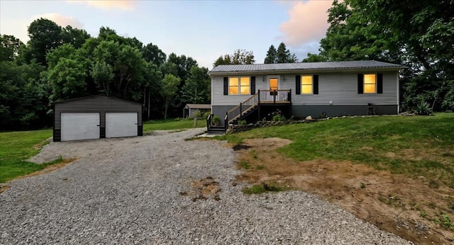 3306 Township Rd Unit 221, Marengo, OH 43334 - view of front of house with an outdoor structure, a front lawn, a garage, and a metal roof