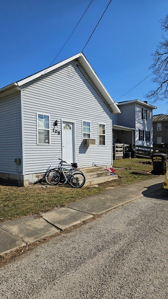 view of front of property featuring cooling unit