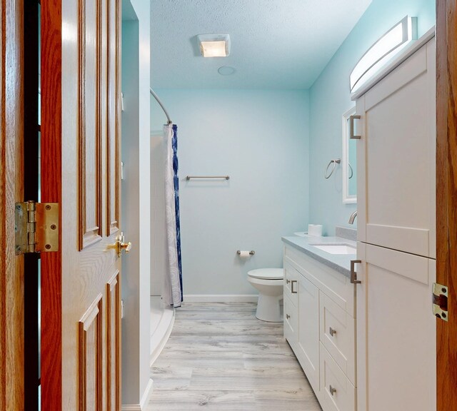 621 Heidi Ln, Mansfield, OH 44904 - bathroom with vanity, wood finished floors, and a shower with shower curtain