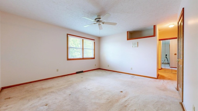 621 Heidi Ln, Mansfield, OH 44904 - empty room featuring carpet flooring, a ceiling fan, and a textured ceiling