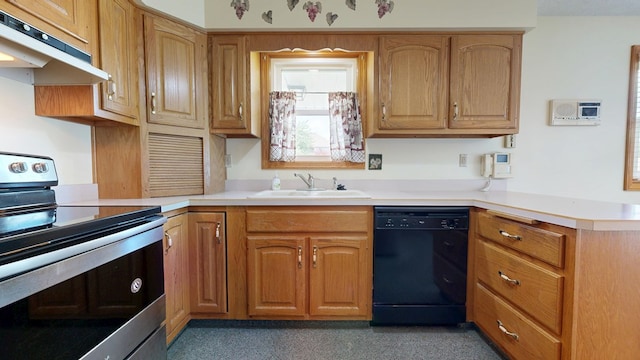 621 Heidi Ln, Mansfield, OH 44904 - kitchen with stainless steel electric stove, dishwasher, under cabinet range hood, light countertops, and a peninsula