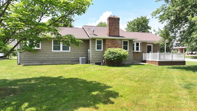 621 Heidi Ln, Mansfield, OH 44904 - back of property with a chimney, a lawn, and a deck