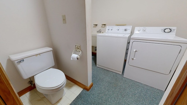 621 Heidi Ln, Mansfield, OH 44904 - bathroom with washing machine and clothes dryer and toilet