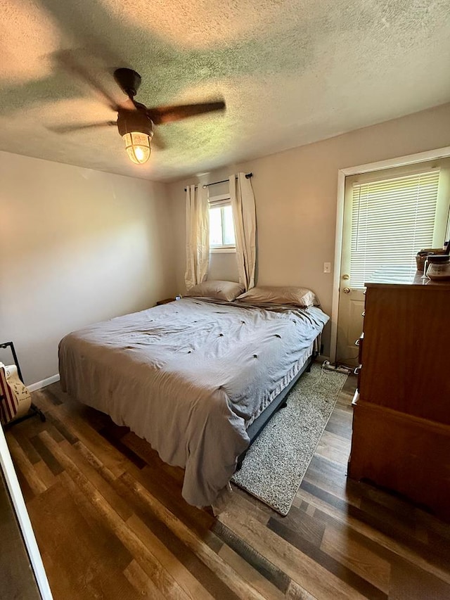 108 Melcher Blvd, Bucyrus, OH 44820 - bedroom with wood finished floors, a textured ceiling, and a ceiling fan