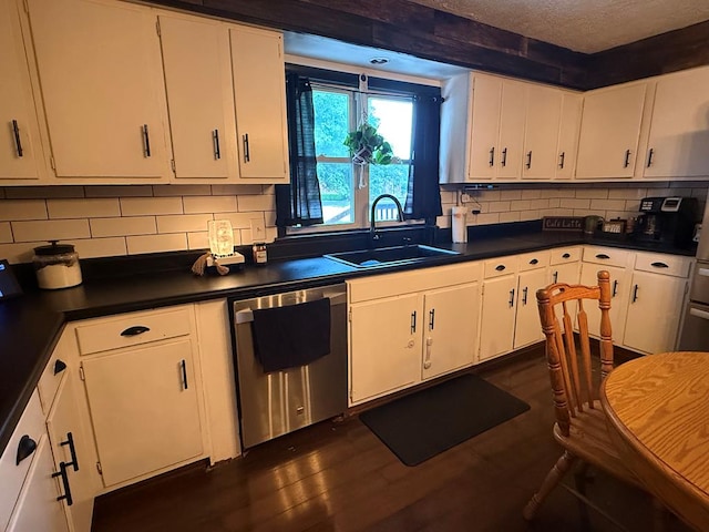 108 Melcher Blvd, Bucyrus, OH 44820 - kitchen with a sink, dishwasher, dark countertops, white cabinets, and a textured ceiling