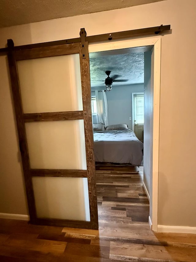 108 Melcher Blvd, Bucyrus, OH 44820 - unfurnished bedroom with wood finished floors, a textured ceiling, and baseboards