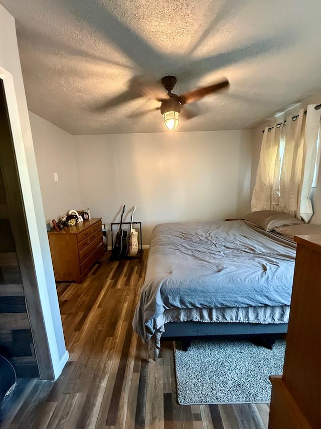 108 Melcher Blvd, Bucyrus, OH 44820 - bedroom featuring wood finished floors, a textured ceiling, and a ceiling fan