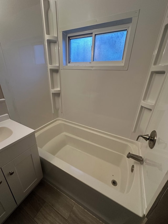 bathroom with shower / bathing tub combination and vanity