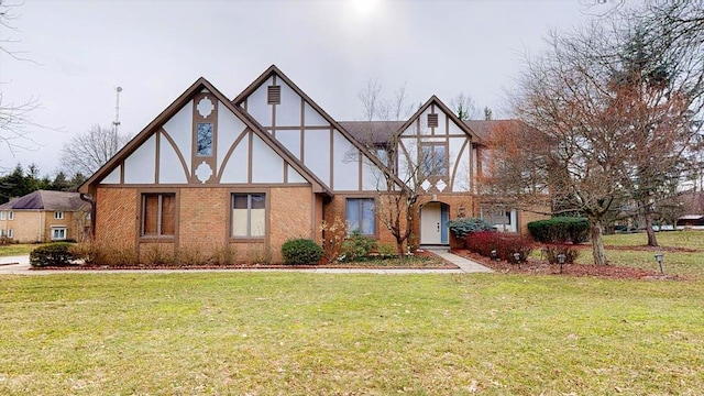 tudor house featuring a front yard