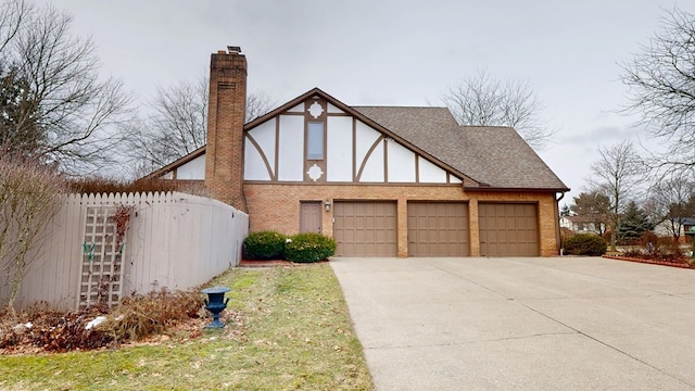 view of side of property with a garage