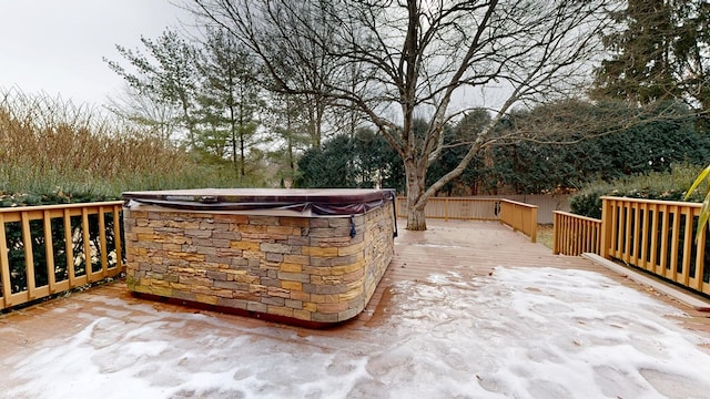 wooden terrace featuring a hot tub