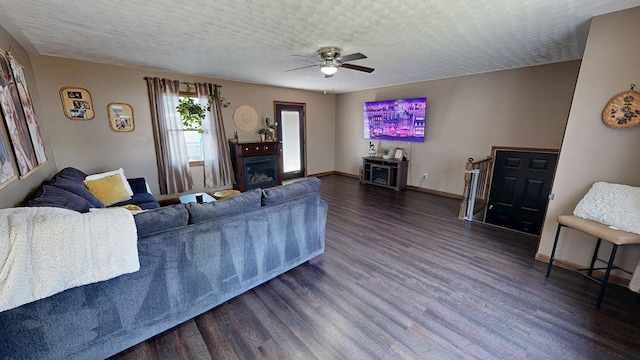 41 Auburn Ave, Shelby, OH 44875 - living room featuring wood finished floors, ceiling fan, a textured ceiling, and a fireplace