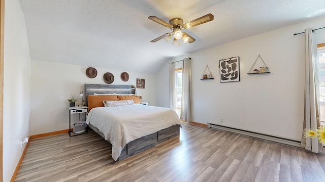 41 Auburn Ave, Shelby, OH 44875 - bedroom with lofted ceiling, light wood finished floors, a baseboard heating unit, and ceiling fan