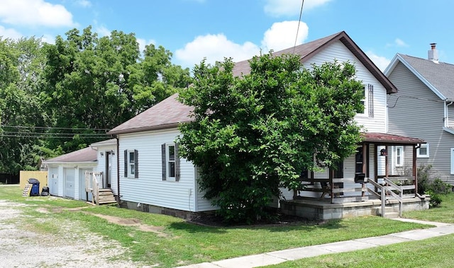 41 Auburn Ave, Shelby, OH 44875 - view of front of property with a porch, a front lawn, and roof with shingles