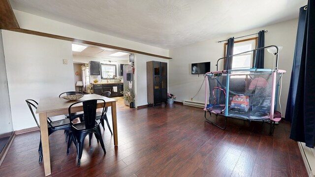 41 Auburn Ave, Shelby, OH 44875 - dining area with wood-type flooring and a baseboard heating unit