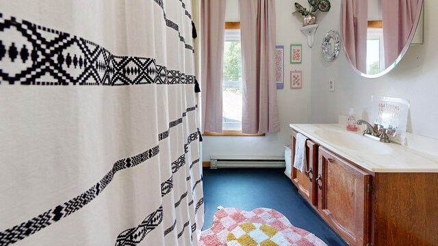 41 Auburn Ave, Shelby, OH 44875 - full bathroom featuring vanity, a baseboard heating unit, and a shower with shower curtain