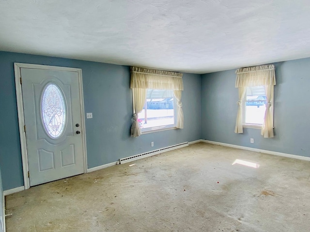 entryway featuring plenty of natural light, a textured ceiling, and a baseboard radiator