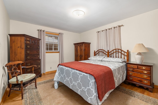 bedroom with hardwood / wood-style floors