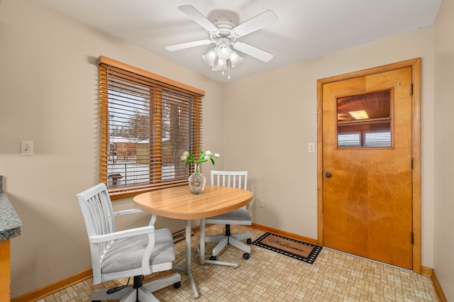 dining space with ceiling fan