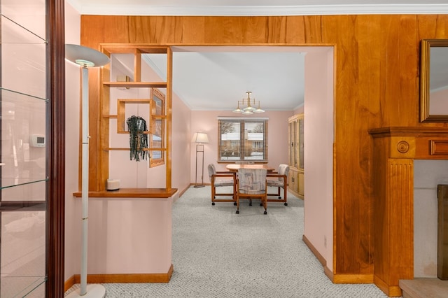 interior space with crown molding, light colored carpet, and a notable chandelier